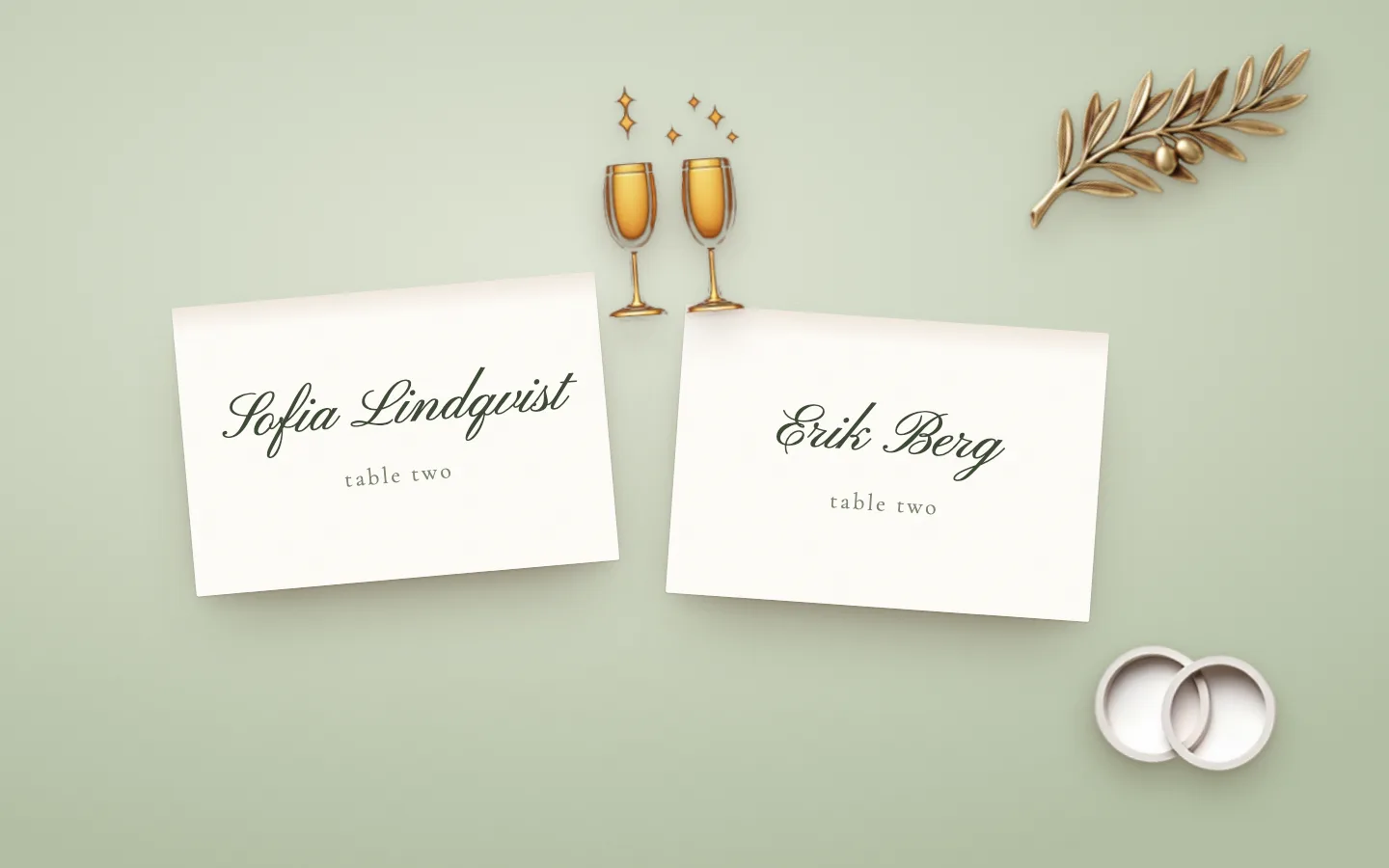 Two place cards on a sage tablecloth, Sofia Lindqvist and Erik Berg at table two, with gold champagne flutes, porcelain rings and a gold olive sprig