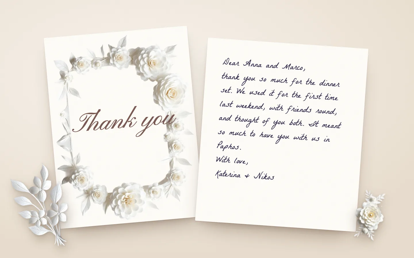 A thank you card framed in white paper roses beside a handwritten note thanking Anna and Marco for the dinner set, with a paper sprig and a paper rose